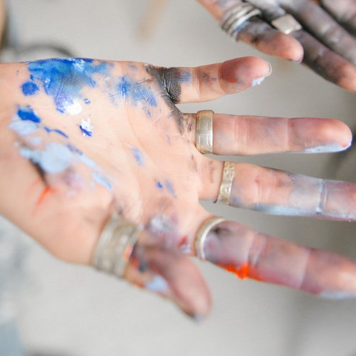 crop-female-artist-with-painted-hands-and-rings-in-light-3959098.jpg